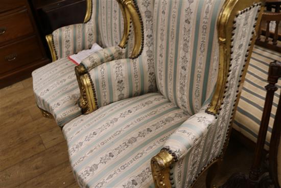 A pair of Louis XVI style gilt fauteuils